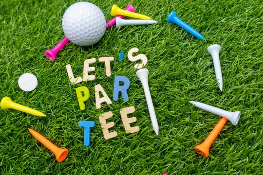 Golf let par tee party invitation for golfer party with golf ball and colourful tees on green grass