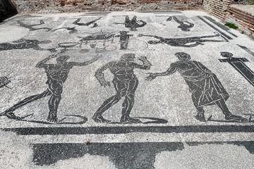 The beautiful Roman floor mosaic of the apodytherium in the Porta Marina thermal baths in Ostia Antica, Rome Italy