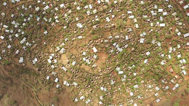 Rotating aerial view of tribal village community of Konso, traditional architecture and building technique in South Ethiopia