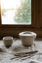 Mold for casting clay products with a mixture inside. Shaped method for making clay dishes. Handwork. Pottery making