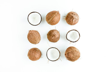 Pattern, texture with coconuts on white background. Tropical abstract background. Flat lay, top view.