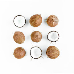 Pattern, texture with coconuts on white background. Tropical abstract background. Flat lay, top view.
