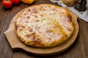 khachapuri with cheese on wooden table. Georgian cuisine