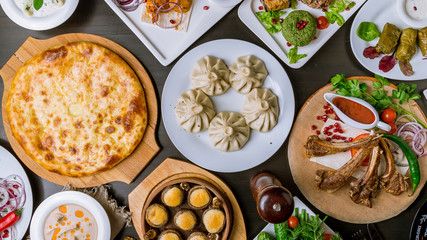Georgian cuisine foodset from khachapuri, khinkali, pkhali, dolma, satsivi top view