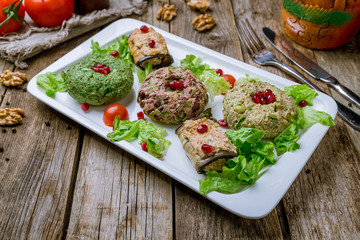 assorted pkhali Georgian cuisine on wooden table