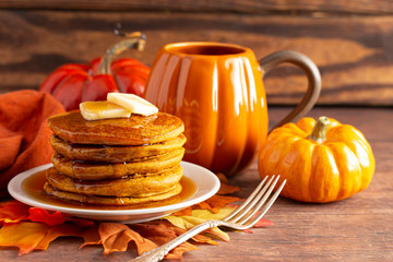 Stack of Pumpkin Spice Flavored Pancakes on a Wooden Table