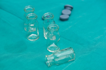 Many glass bottles for collecting specimens in operating room