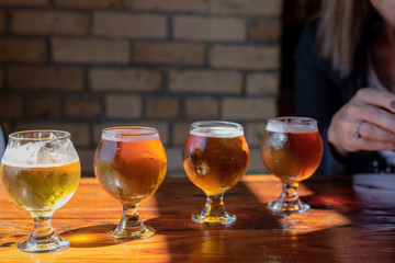 Beer flight on rustic wood table