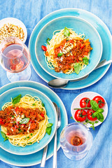 Spaghetti bolognese pasta with tomato sauce and   parmesan cheese and fresh basil