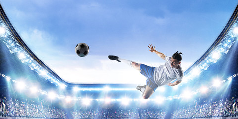 Fototapeta na wymiar Football player plays his best soccer match