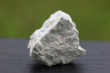 Kaolinite stone isolate on green  background
