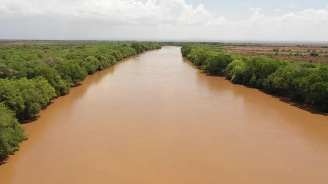 Low angle aerial view of Omorate river flowing through Ethiopia, close to the border with Kenya, natural scenery and landscapes in Africa