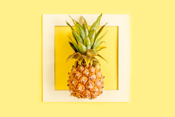 Top view pineapple isolated on yellow background with copy space for text. Template blog social media. Food concept. Minimal style. flat lay