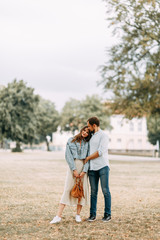 Obraz premium love story in Berlin. couple walking on alley in Park..