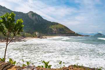 Landscape at Prainha Beach, Rio de Janeiro, on a windy day with the sea full of waves