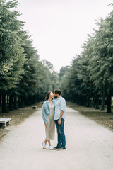 Fototapeta na wymiar love story in Berlin. couple walking on alley in Park..
