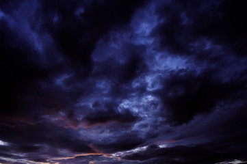 Fototapeta na wymiar Black clouds float in the sky in the evening