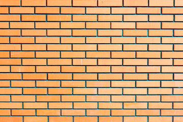 Fototapeta premium Texture of a brick wall with cracks and scratches which can be used as a background