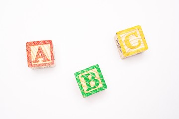 ABC wooden blocks isolated against white