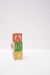 ABC wooden blocks isolated against white