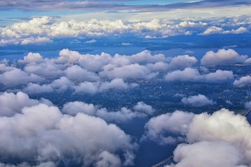 Seattle, Washington, 2019 Cityscape Aerial Panoramic View through cloudscape including Ocean, rivers and rural urban. USA.