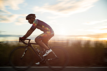 Soft focus of man cycling road bike in the morning. Sports and outdoor activities concept.