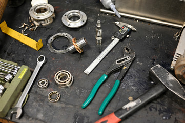 Unfolded tools on machine in locksmith's workshop.