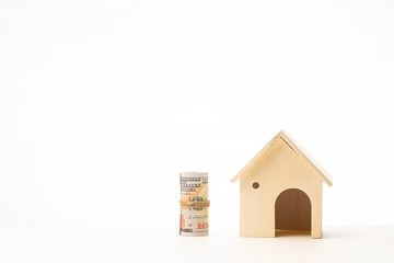 Miniature wooden house isolated against white background 