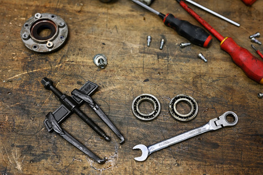 Unfolded tools on machine in locksmith's workshop.