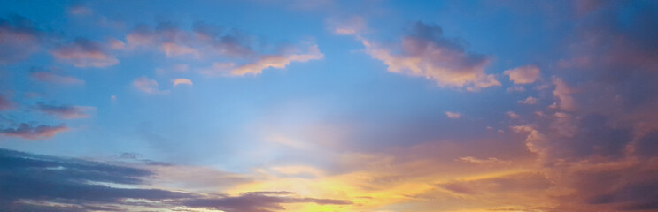 Panorama of Beautiful skyscape clear blue sky and golden cloud background during sunset. Clearing...
