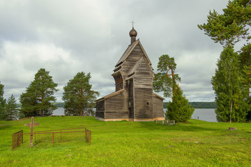 View of the old wooden church of St. George the Victorious (1492) on a cloudy August day. Rodionovo (Yuksovichi). Leningrad region, Russia