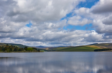 Looking up Glen Damff over the Backwater Reservoir in Glen Isla near Kirriemuir on a fine May morning. Angus, Scotland.