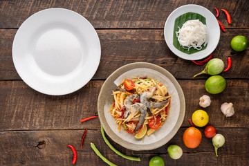 Som Tam Thai -Ingredients Papaya Salad Thai Food Style on wooden table background. Thai Food Concept. Top View