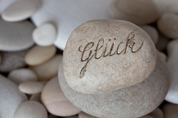 Fototapeta na wymiar Engraved Pebble With German Word For Happiness