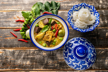 Thai food chicken green curry on dark wooden background. top view , Free space for text input