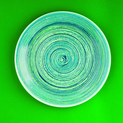 Mint color plate on the saturated green background