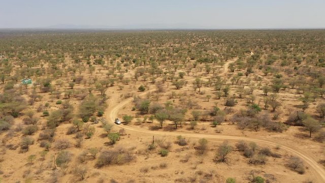 Panoramic aerial view of four wheel drive navigating unpaved road in remote region in South Ethiopia, travel and natural scenery in Africa
