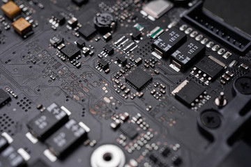 A black colour waterproof Printed Circuit Board with CPU, SMD & IC mounted part on board
