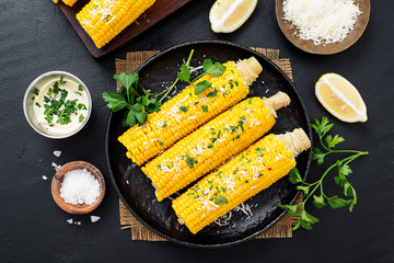 Steamed sweet corn with greens and grated parmesan.