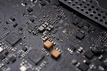 A black colour waterproof Printed Circuit Board with CPU, SMD & IC mounted part on board