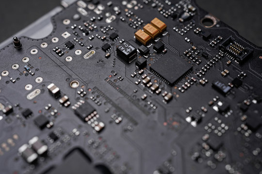 A black colour waterproof Printed Circuit Board with CPU, SMD & IC mounted part on board