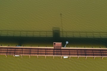 Aerial view of new wooden Bridge over a lake