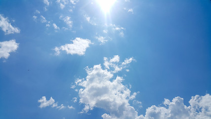 beautiful background of clouds, clearly visible lines of white clouds and blue sky, the top is a sunbeam, copy space for text