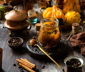 homemade pumpkin spice mix in glass jar on rustic wooden table