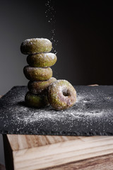 A delicious green tea doughnuts on dark background