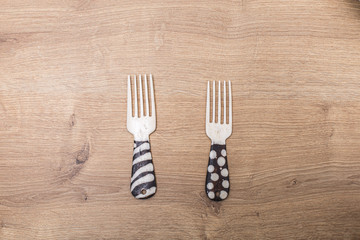 African handmade fork cutlery close up on a wooden background