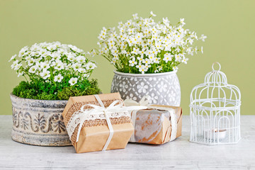 Flowers and gifts on the table.