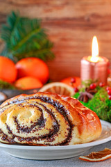 Christmas swedish poppy bun and decorations in the background.