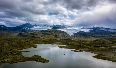 Fototapeta na wymiar Smørstabbreen glacier with lake Presteinsvatnet in Jotunheimen national park, Norway