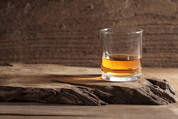 scotch whiskey in glass on a wooden table with a blank space for a text, scotch whiskey in rustic bar background